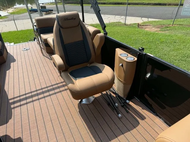 Slide: The Image of The image shows the interior of a 2027 Bentley Pontoons Elite 223 Admiral with luxurious seating. - 8