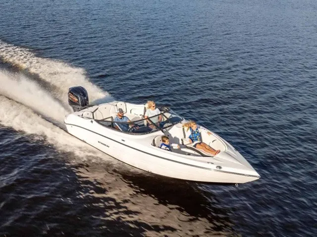 Slide: The Image of A white motorboat speeding across the water with four people on board. - 2