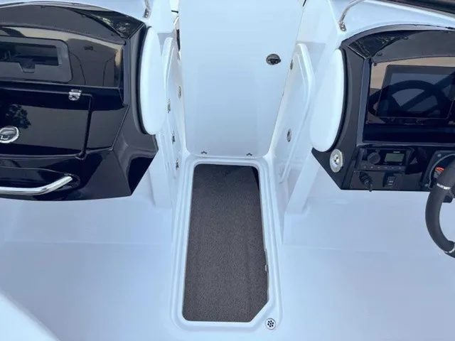 Slide: The Image of The image shows the cockpit of a Stingray 23 OSX boat with modern controls. - 12