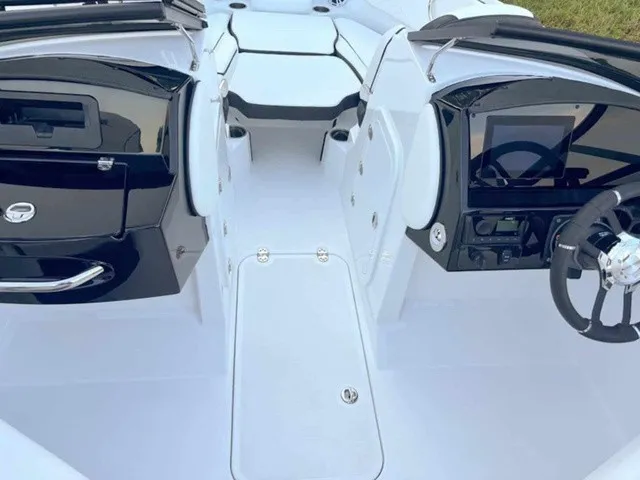 Slide: The Image of The image shows the cockpit of a modern boat with white and black accents. - 11