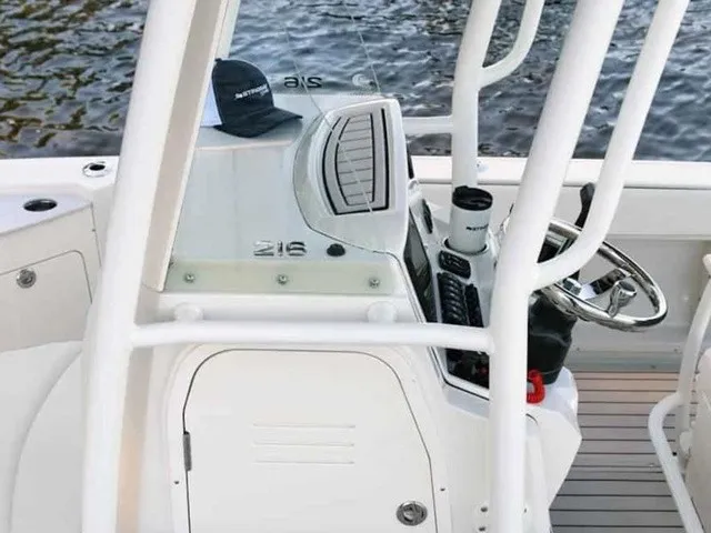 Slide: The Image of The image shows the cockpit of a 2027 Stingray 20 CC boat with a modern helm station. - 8