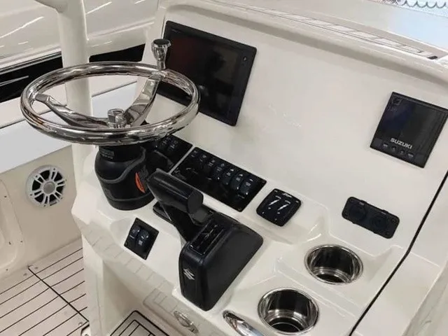 Slide: The Image of The image shows the helm of a Stingray 20 CC boat with modern controls and a sleek steering wheel. - 7