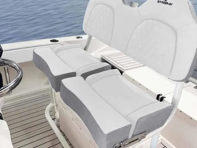 Slide: The Image of The image shows the seating area of a Stingray 20 CC boat with white upholstery and gray accents. - 16