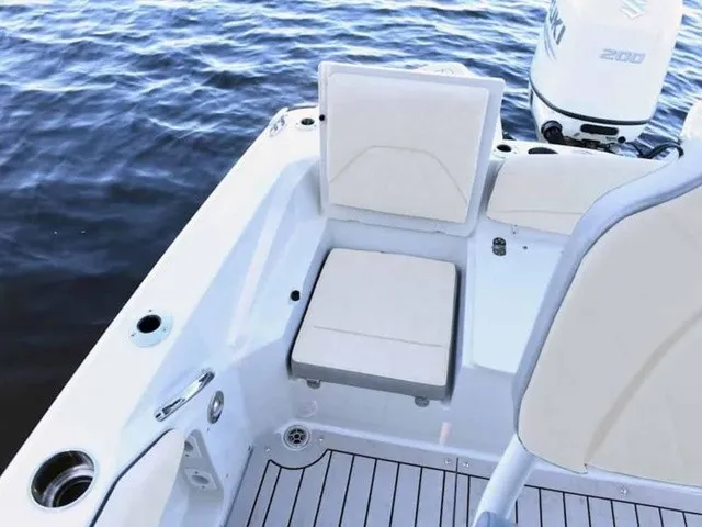 Slide: The Image of The image shows the cockpit of a 2027 Stingray 20 CC boat with beige seating. - 4