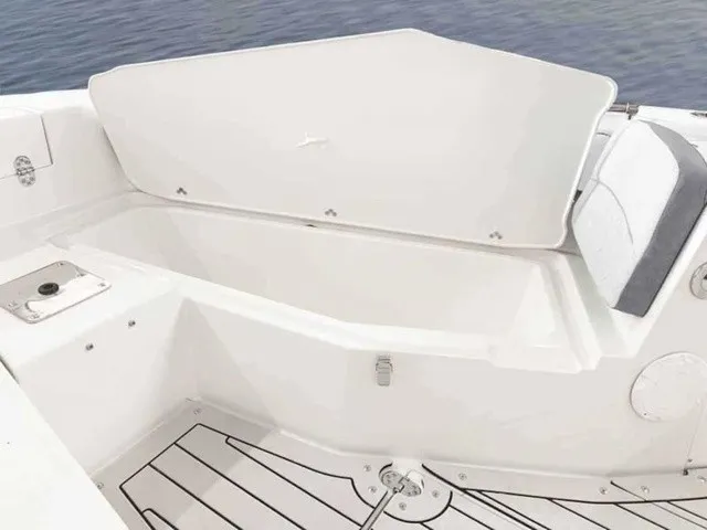Slide: The Image of The image shows an open storage compartment on a boat with white interior and gray accents. - 5