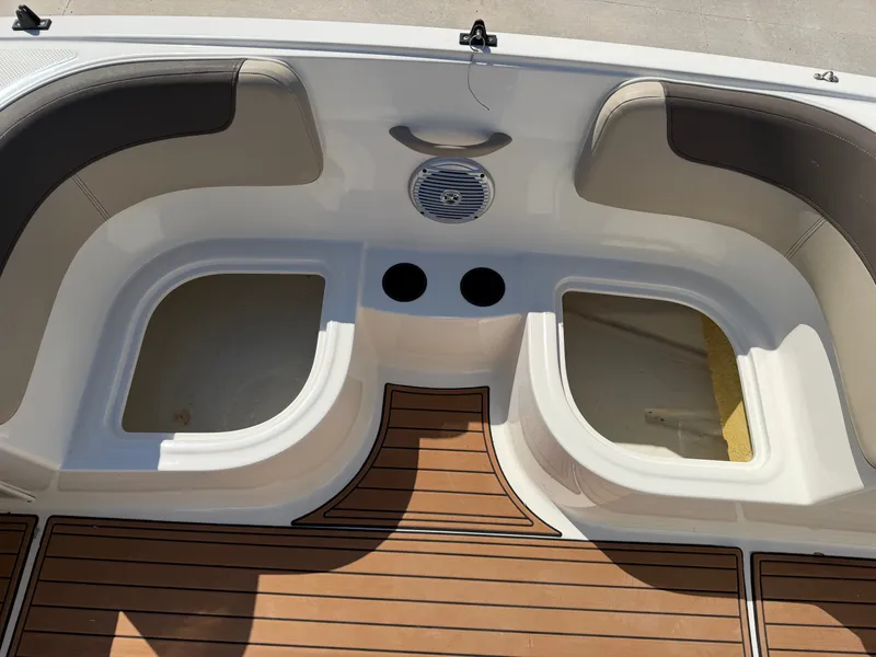 Slide: The Image of The image shows the cockpit of a 2017 Bayliner Element 16 with wood-patterned flooring. - 17