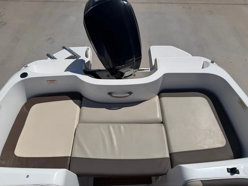 Slide: The Image of The image shows the stern of a 2017 Bayliner Element 16 with cushioned seating. - 22