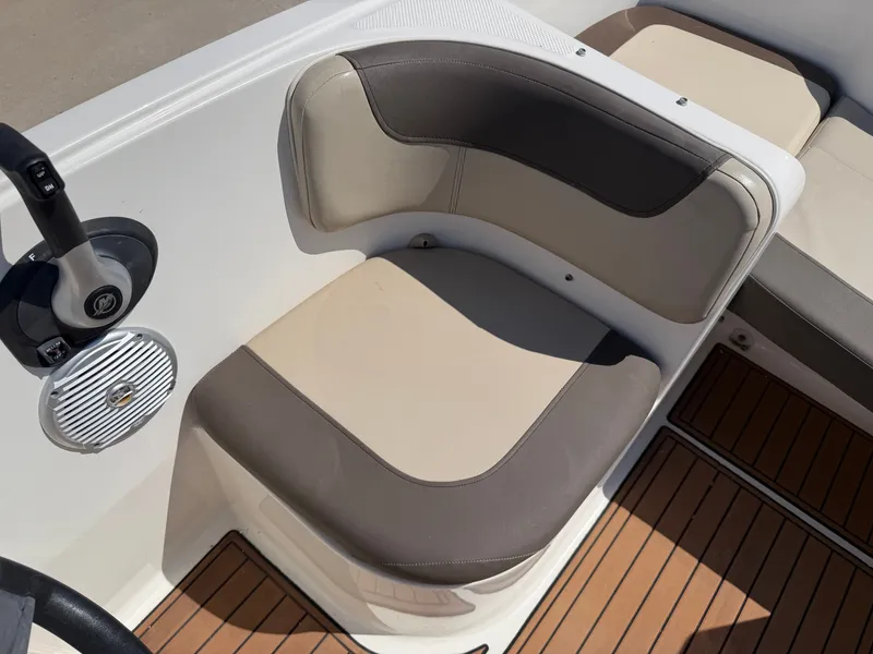 Slide: The Image of A seating area with beige and gray upholstery on a 2017 Bayliner Element 16 boat. - 20