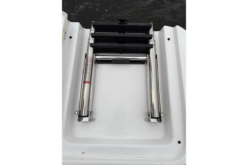 Slide: The Image of Folded boat ladder on 2025 Monterey Elite 27 OB deck. - 60