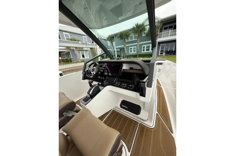 Slide: The Image of 2025 Monterey Elite 27 OB boat interior with modern dashboard and seating. - 42