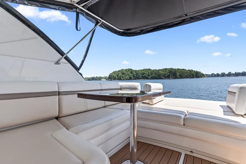 Slide: The Image of Luxurious seating area on 2013 Sea Ray 410 Sundancer yacht with scenic water view. - 28