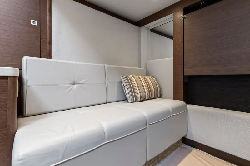 Slide: The Image of Luxurious interior of 2013 Sea Ray 410 Sundancer with white leather seating. - 22