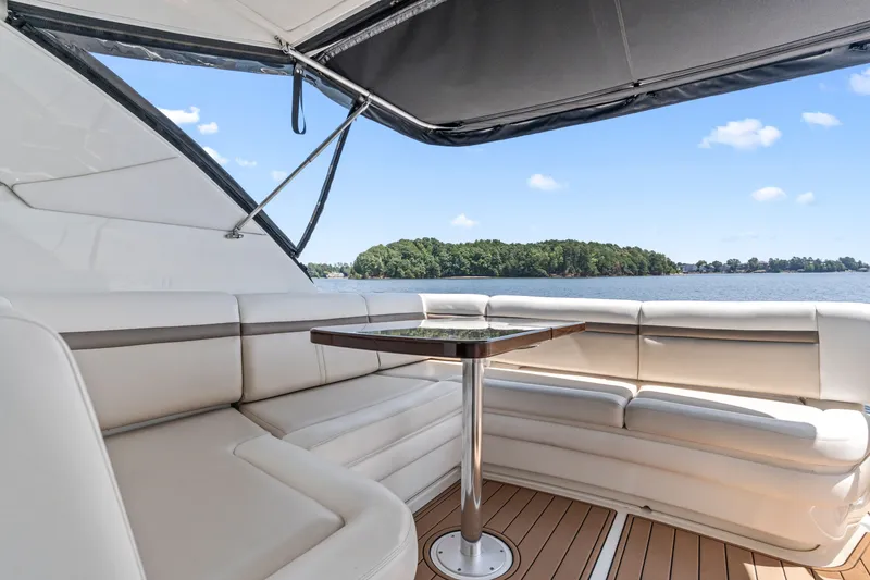 Slide: The Image of Luxurious seating area on 2013 Sea Ray 410 Sundancer yacht with scenic water view. - 27