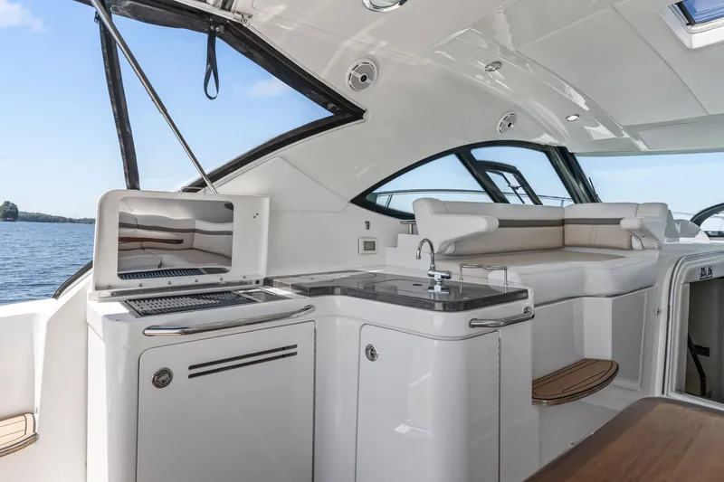 Slide: The Image of Luxurious interior of 2013 Sea Ray 410 Sundancer yacht with sleek design and modern amenities. - 32