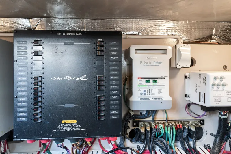 Slide: The Image of Electrical panel of a 2013 Sea Ray 410 Sundancer boat, featuring ProNautic charger. - 53