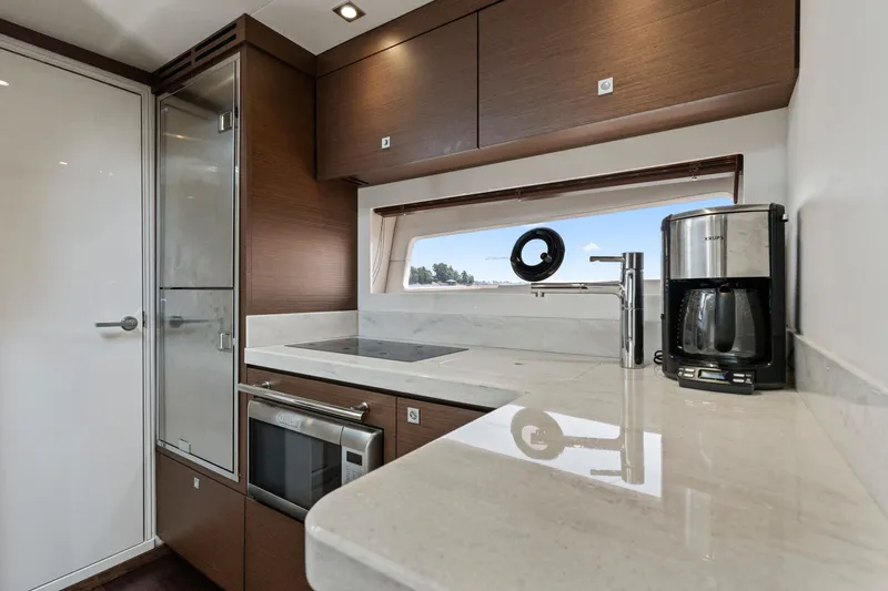 Slide: The Image of Modern kitchen interior of 2013 Sea Ray 410 Sundancer yacht with sleek appliances. - 15