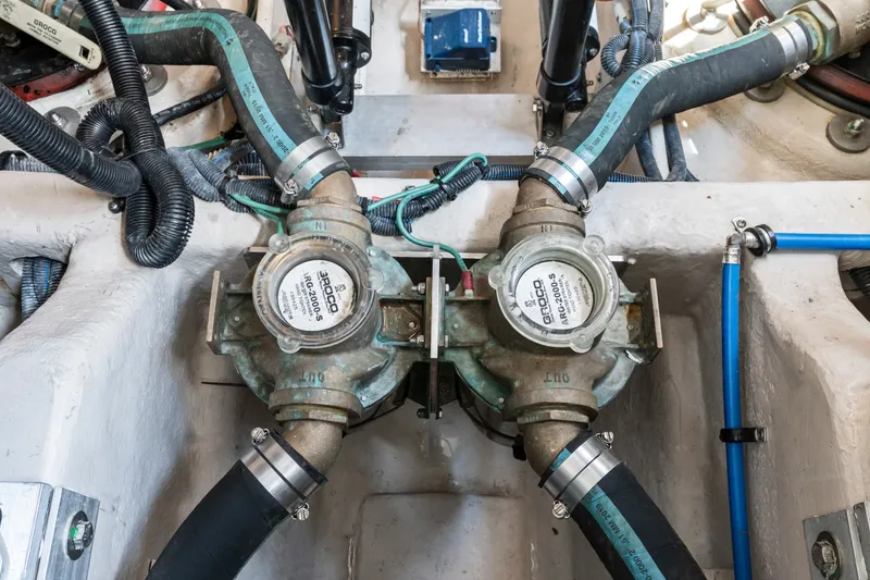 Slide: The Image of Engine room of 2013 Sea Ray 410 Sundancer showing plumbing and mechanical components. - 48