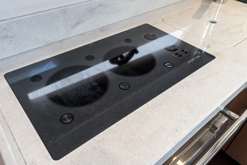 Slide: The Image of Kenyon cooktop on 2013 Sea Ray 410 Sundancer yacht kitchen counter. - 18