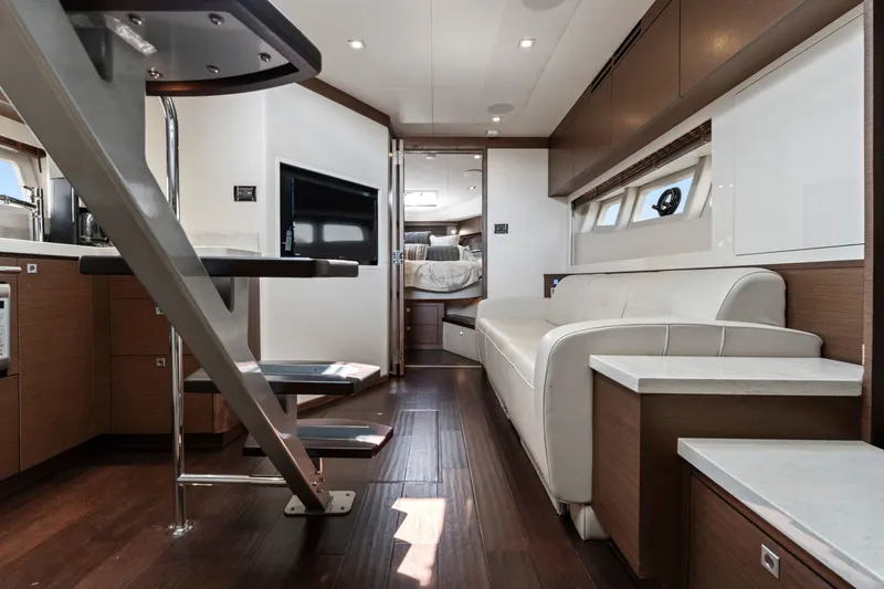 Slide: The Image of Luxurious interior of 2013 Sea Ray 410 Sundancer yacht with modern furnishings and sleek design. - 24