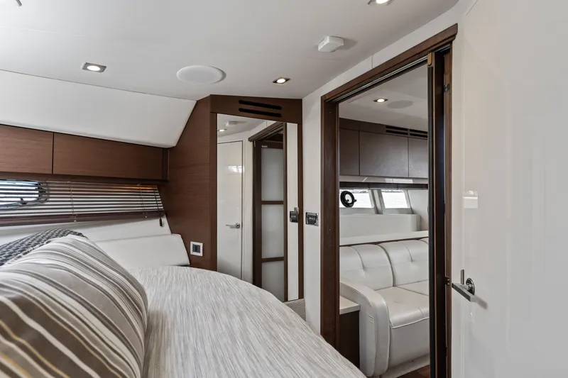 Slide: The Image of Luxurious interior of 2013 Sea Ray 410 Sundancer yacht with modern furnishings and elegant design. - 8