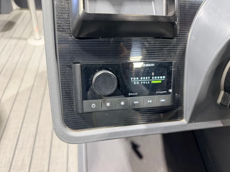 Slide: The Image of Close-up of a boat audio system with controls and display. - 24