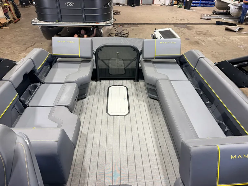 Slide: The Image of Interior of a 2023 Manitou 22 Explore Tritoon with gray upholstery and spacious seating area. - 8