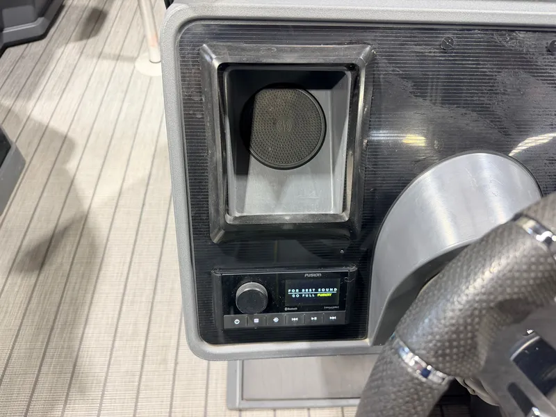 Slide: The Image of Close-up of a boat cockpit with speaker and control panel. - 25