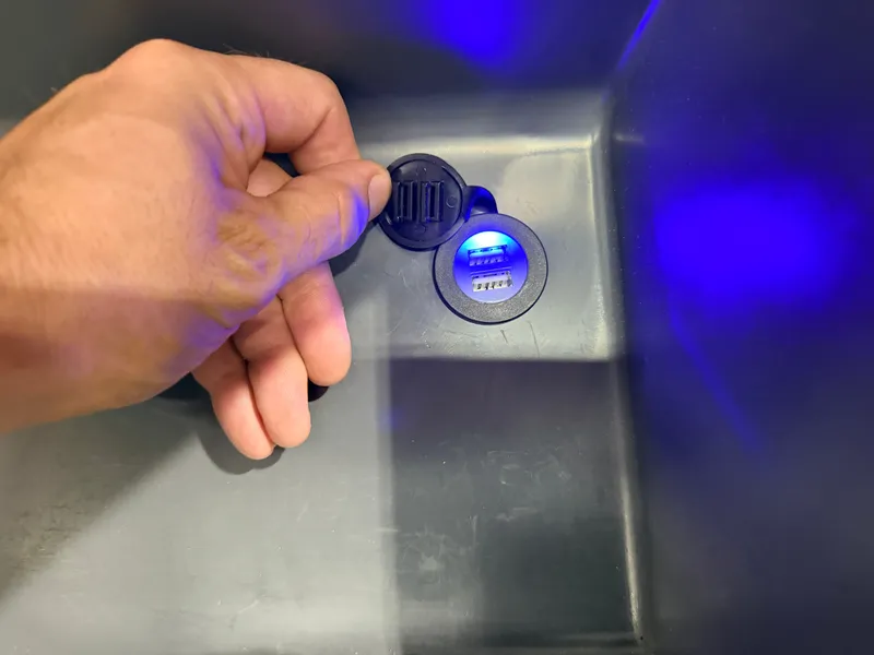 Slide: The Image of Close-up of a USB port with blue lighting in a boat. - 31