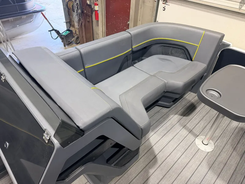 Slide: The Image of The image shows a gray seating area with yellow accents on a boat. - 11