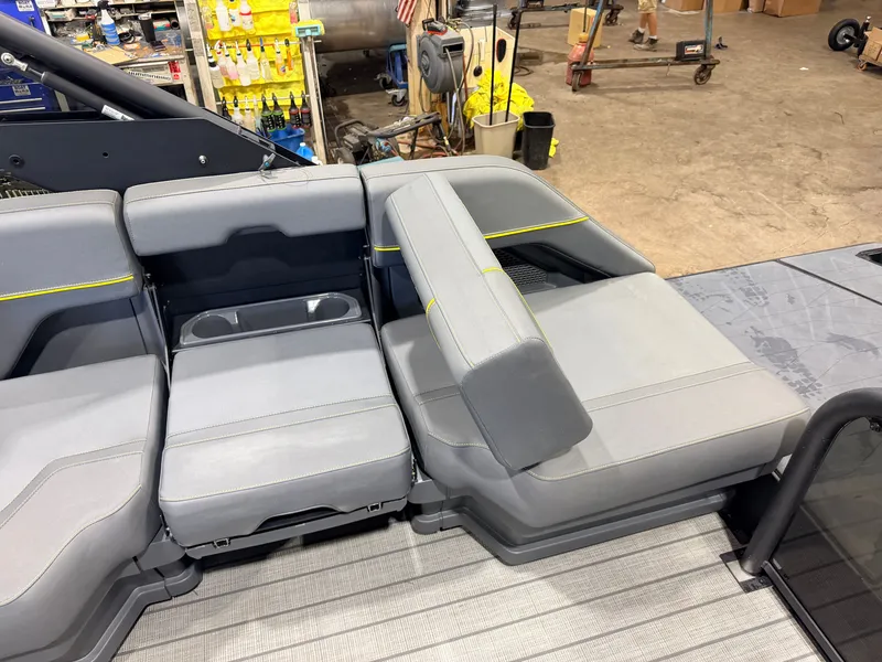 Slide: The Image of Interior of a Manitou 22 Explore Tritoon with gray upholstery and yellow accents. - 42