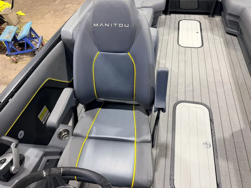 Slide: The Image of Interior of a 2023 Manitou 22 Explore Tritoon with gray seats and yellow stitching. - 20