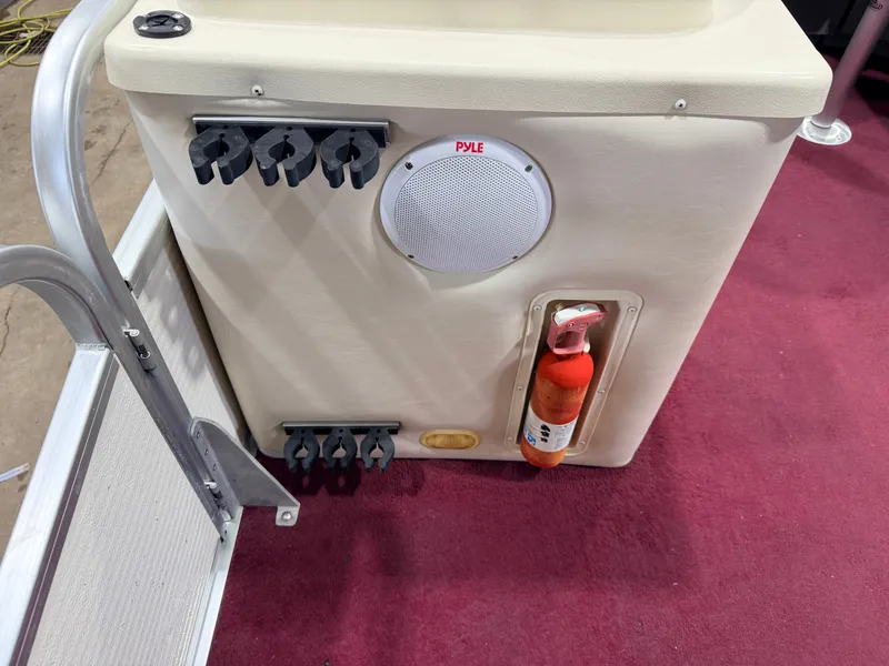 Slide: The Image of A speaker and fire extinguisher are mounted on the interior wall of a boat. - 18