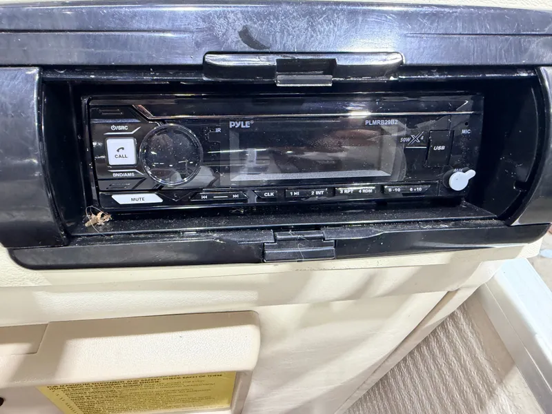 Slide: The Image of A Pyle car stereo is installed in a boat dashboard. - 24