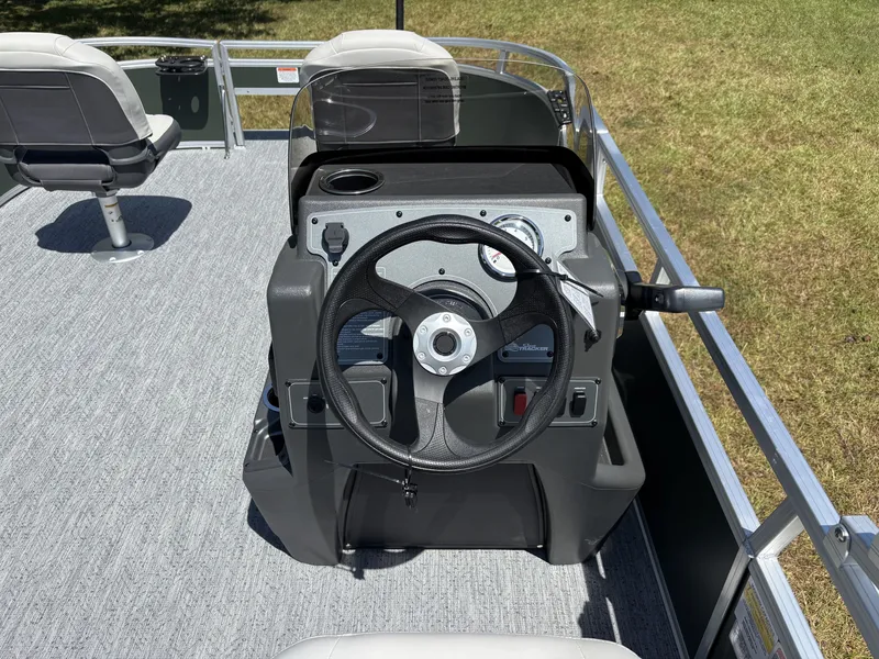Slide: The Image of The image shows the helm of a 2027 Sun Tracker Bass Buggy 16 XL Select. - 15