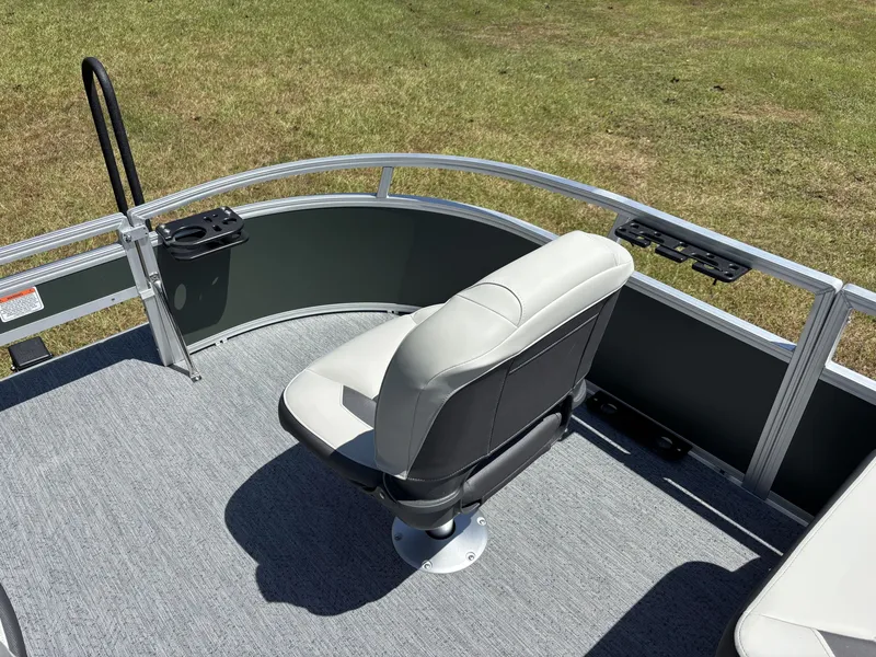 Slide: The Image of A boat with a cushioned seat on a carpeted floor, surrounded by a metal railing. - 16