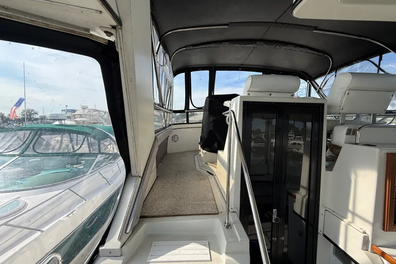 Slide: The Image of 1989 Carver 3807 Aft Cabin Motor Yacht interior with seating and windows. - 16