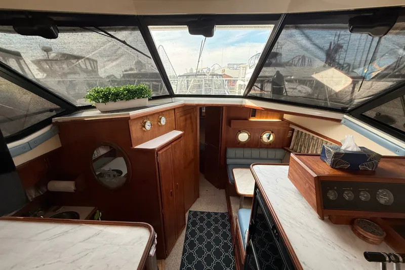 Slide: The Image of Interior of 1989 Carver 3807 Aft Cabin Motor Yacht with wood accents and nautical decor. - 40
