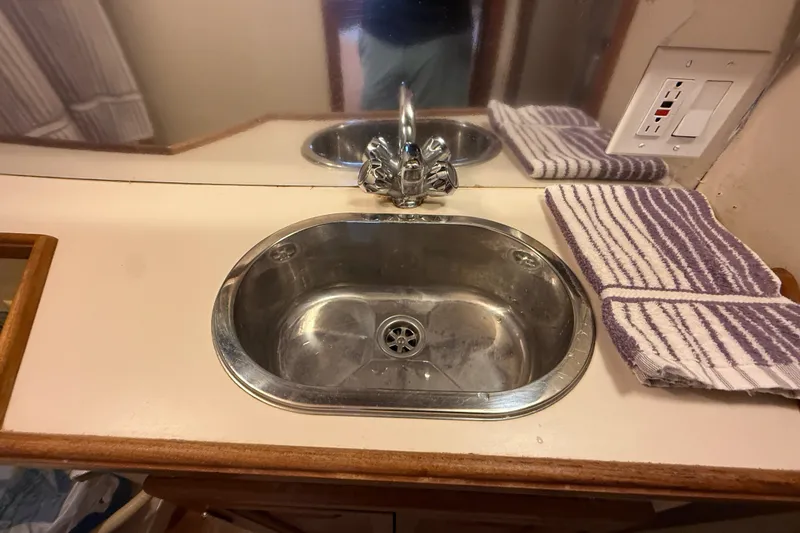 Slide: The Image of Stainless steel sink in 1989 Carver 3807 Aft Cabin Motor Yacht bathroom. - 65