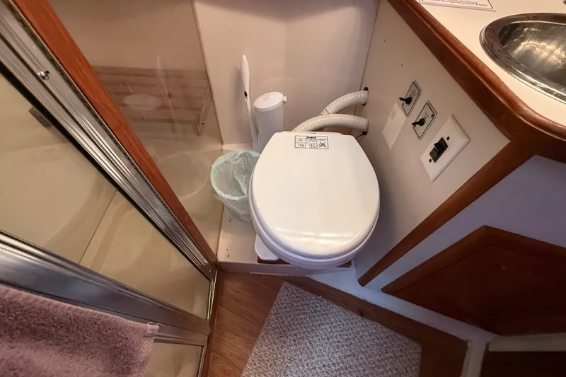 Slide: The Image of Bathroom in 1989 Carver 3807 Aft Cabin Motor Yacht with toilet and shower. - 55