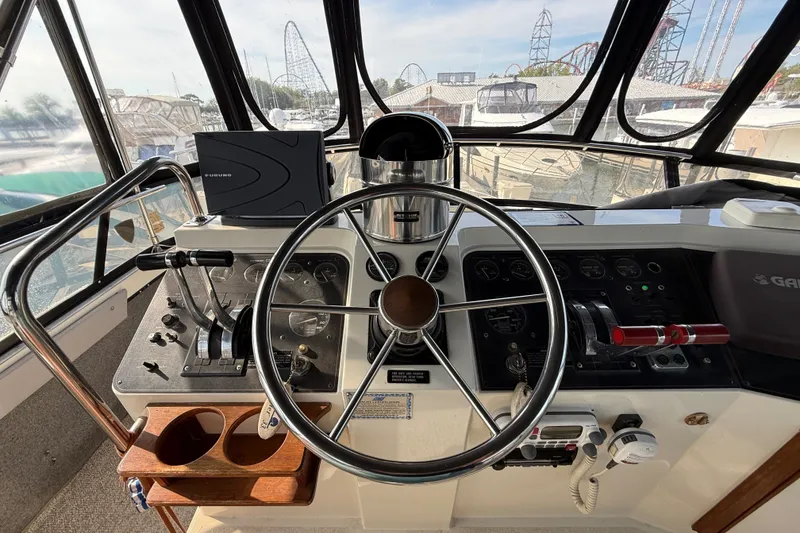 Slide: The Image of Helm of 1989 Carver 3807 Aft Cabin Motor Yacht with steering wheel and controls. - 20