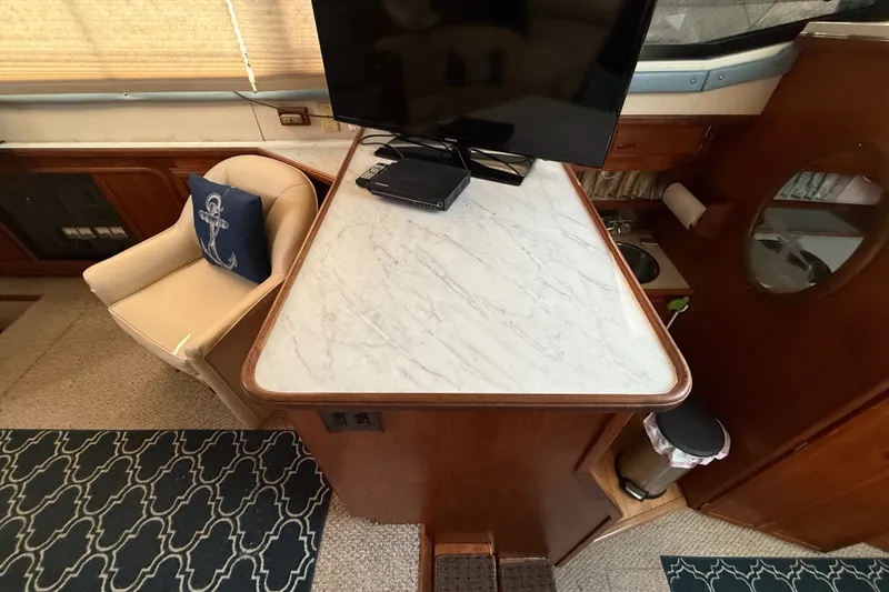 Slide: The Image of Interior of 1989 Carver 3807 Aft Cabin Motor Yacht with TV and seating area. - 36