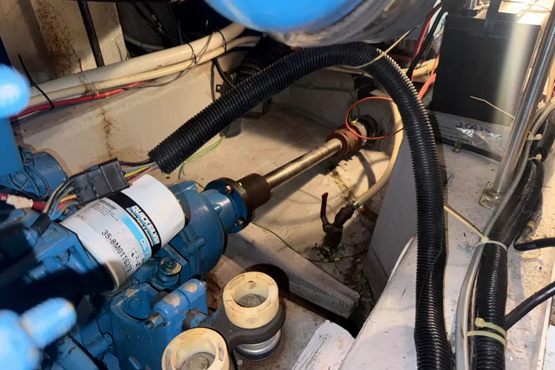 Slide: The Image of Engine room of 1989 Carver 3807 Aft Cabin Motor Yacht, showing mechanical components and wiring. - 69
