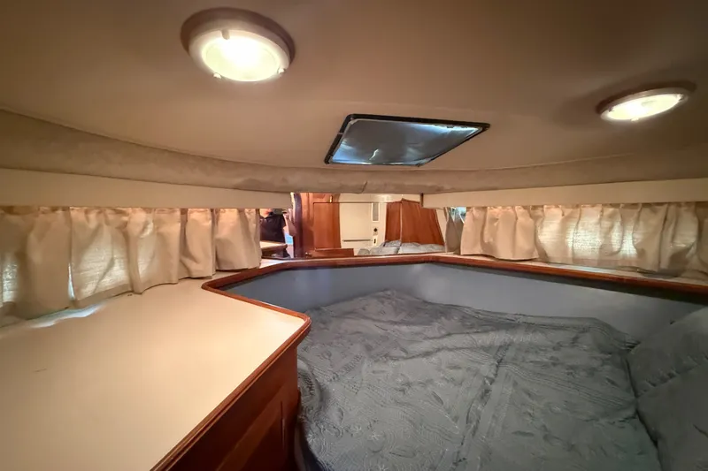 Slide: The Image of Interior cabin of 1989 Carver 3807 Aft Cabin Motor Yacht with cozy bedding and curtains. - 59