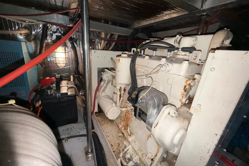 Slide: The Image of Engine room of 1989 Carver 3807 Aft Cabin Motor Yacht with visible machinery and wiring. - 71