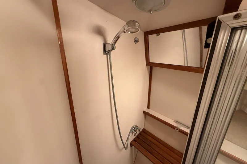 Slide: The Image of Shower area in 1989 Carver 3807 Aft Cabin Motor Yacht with wooden accents. - 56