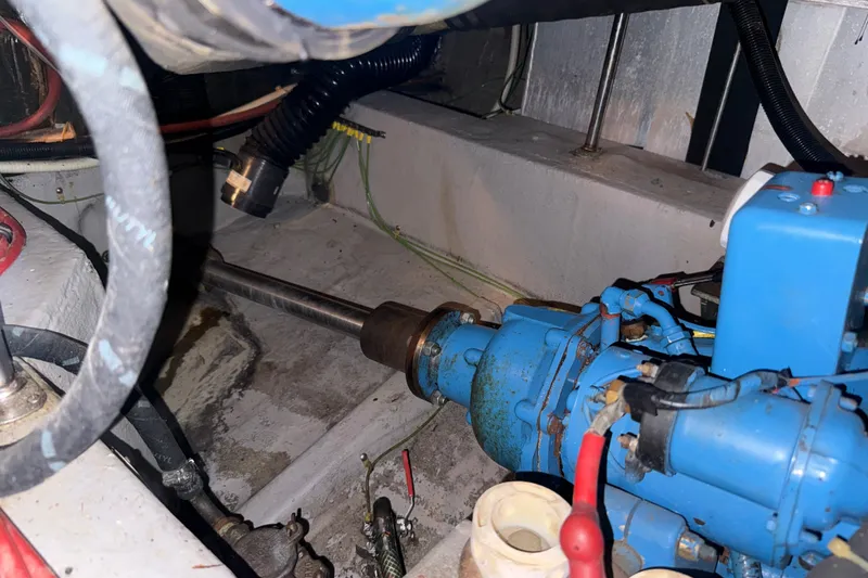 Slide: The Image of Engine room of 1989 Carver 3807 Aft Cabin Motor Yacht with visible machinery components. - 70