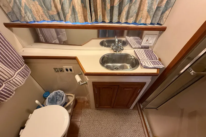 Slide: The Image of Bathroom interior of 1989 Carver 3807 Aft Cabin Motor Yacht with sink and shower. - 64