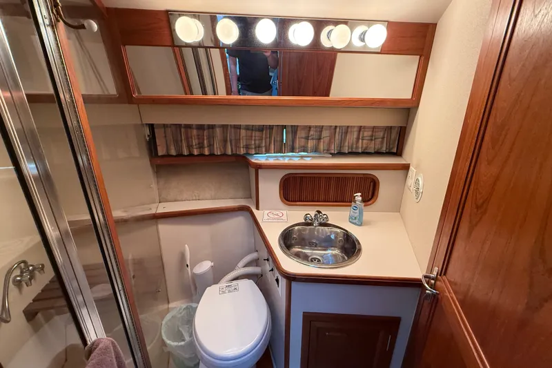 Slide: The Image of Bathroom interior of 1989 Carver 3807 Aft Cabin Motor Yacht with sink and toilet. - 53