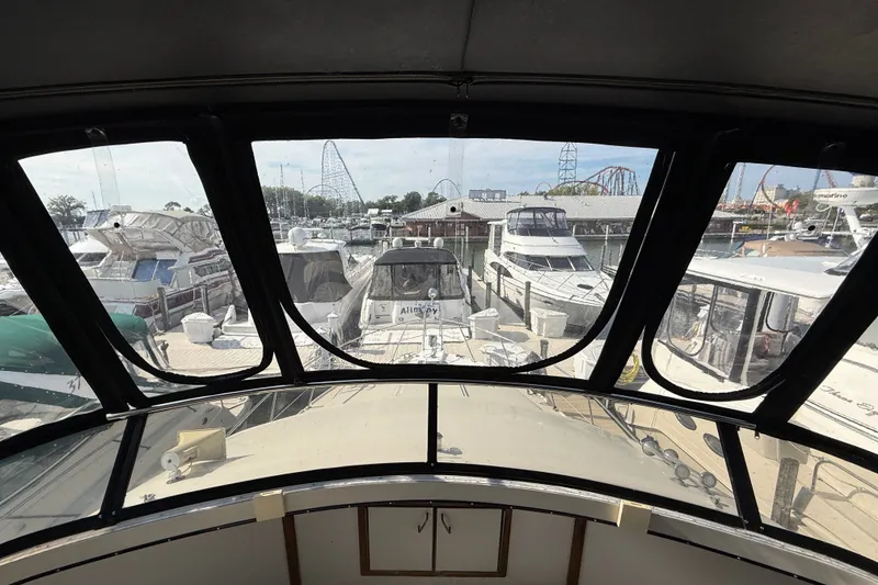 Slide: The Image of 1989 Carver 3807 Aft Cabin Motor Yacht docked at marina, view from helm. - 23
