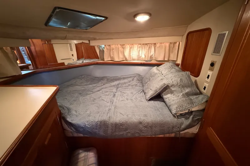 Slide: The Image of Cozy bedroom in 1989 Carver 3807 Aft Cabin Motor Yacht with elegant bedding. - 52